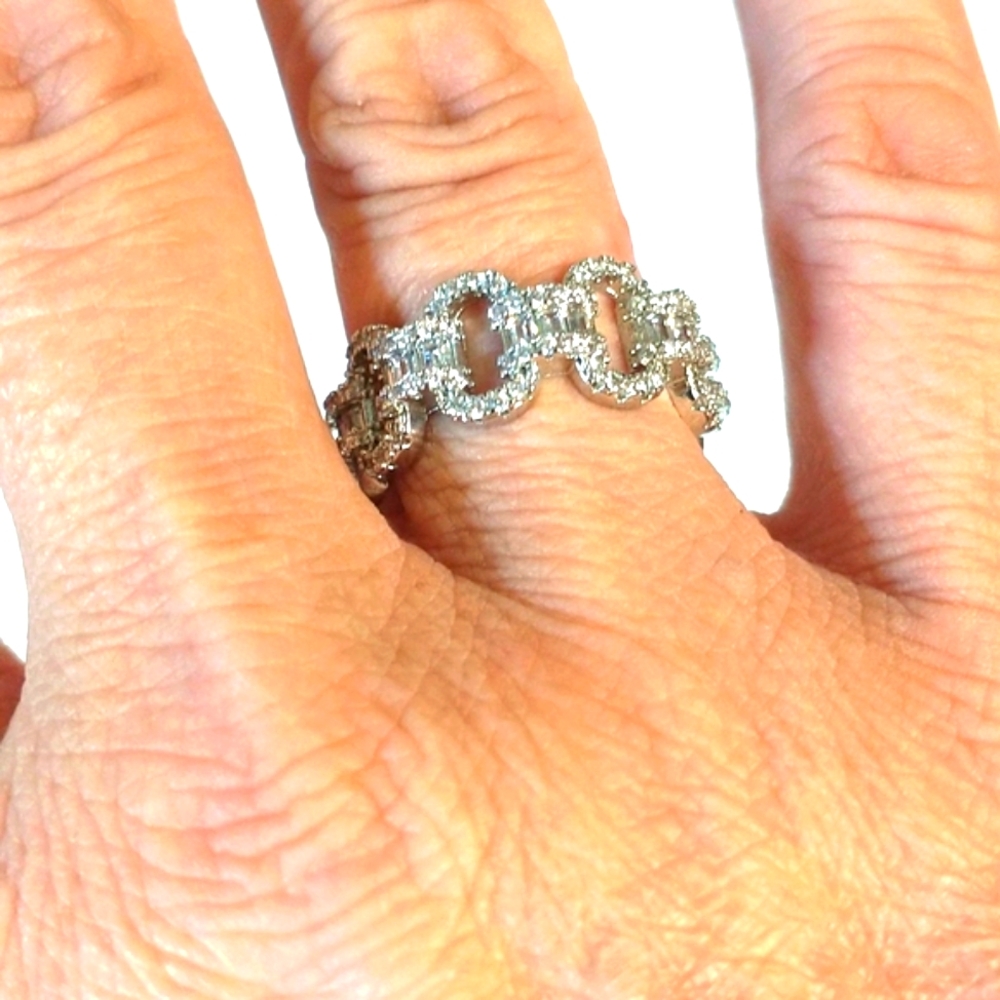 Two cubic zirconia rings size 8 & 8.5 both marked 925.